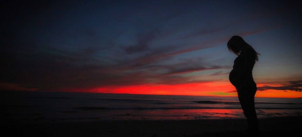 pregnant-beach-sunset-mother-51386